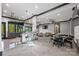 Finished basement with bar, stools, dining table, and a comfortable seating area, ideal for entertaining at 385 Squirrel Ln, Clover, SC 29710