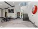 Finished basement featuring a staircase, television, dining table and chairs, and unique Coca-Cola sign at 385 Squirrel Ln, Clover, SC 29710