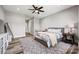 Comfortable bedroom with a ceiling fan, carpeted floor, and a light color scheme at 385 Squirrel Ln, Clover, SC 29710