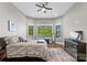 Bedroom with a large bay window overlooking trees and water with a plush bed at 385 Squirrel Ln, Clover, SC 29710