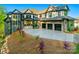 Beautiful exterior view of home featuring a three-car garage, manicured landscaping, and a stone and brick facade at 385 Squirrel Ln, Clover, SC 29710