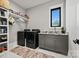 Functional laundry room with modern appliances, sleek cabinetry, and countertop space at 385 Squirrel Ln, Clover, SC 29710