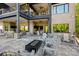 Multi-level patio with a cozy seating areas, a fire pit, an outdoor bar, and wooded views at 385 Squirrel Ln, Clover, SC 29710