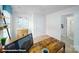 Office with a dark wood desk and shelves, light carpet, and a window at 3920 Coleman Dr, Charlotte, NC 28215