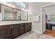 Elegant bathroom featuring dual vanity, tile floor, and a large mirror at 4012 Brandywine Ter, Lancaster, SC 29720
