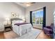 Cozy bedroom with a comfortable bed, ceiling fan, a bright window, and stylish furnishings for a serene retreat at 4012 Brandywine Ter, Lancaster, SC 29720