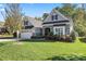 Charming home featuring a stone facade, manicured lawn, and a two-car garage at 4012 Brandywine Ter, Lancaster, SC 29720