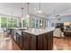 Open-concept kitchen with a spacious island, stainless steel sink, and seamless flow to living spaces at 4012 Brandywine Ter, Lancaster, SC 29720