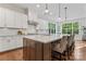 Modern kitchen featuring white cabinetry, a large center island, and stainless steel appliances at 4012 Brandywine Ter, Lancaster, SC 29720