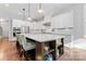 Spacious kitchen with white cabinets, a large island, and seating for casual dining at 4012 Brandywine Ter, Lancaster, SC 29720