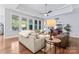 Inviting living room with hardwood floors, comfortable seating, and a seamless connection to the outdoors at 4012 Brandywine Ter, Lancaster, SC 29720