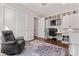 Functional office space with built-in shelves, a desk, and a comfortable leather chair at 4012 Brandywine Ter, Lancaster, SC 29720
