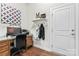 A well-lit home office features a wooden desk, stylish decor, and ample natural light at 4012 Brandywine Ter, Lancaster, SC 29720
