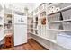 Spacious walk-in pantry with ample shelving, perfect for organized storage, including a refrigerator and wooden stool at 4012 Brandywine Ter, Lancaster, SC 29720