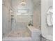 The walk-in shower features tiled walls and floors and a built-in bench at 4012 Brandywine Ter, Lancaster, SC 29720