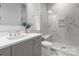 Modern bathroom with gray vanity, quartz countertop, and glass shower with a built in seat at 405 Sugar Maple Ln # 41, Weddington, NC 28104