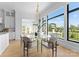 Bright dining room with large windows offering scenic views and featuring modern décor at 405 Sugar Maple Ln # 41, Weddington, NC 28104