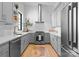 Modern kitchen featuring stainless steel appliances, gray cabinetry, and a white subway tile backsplash at 405 Sugar Maple Ln # 41, Weddington, NC 28104