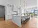 Bright and spacious kitchen featuring a large island, custom cabinetry, and natural light from large windows at 405 Sugar Maple Ln # 41, Weddington, NC 28104
