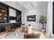 Bright office space with custom built-ins, modern desk, and large windows providing natural light at 405 Sugar Maple Ln # 41, Weddington, NC 28104