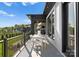 Outdoor dining area on a patio with wrought iron railing, overlooking manicured lawn and neighborhood at 405 Sugar Maple Ln # 41, Weddington, NC 28104