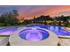 Luxury pool area with a spa and integrated water feature, set against a backdrop of mature trees at 405 Sugar Maple Ln # 41, Weddington, NC 28104