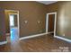 Living room featuring hard surface flooring and ample natural light from various rooms at 421 E Cemetary St, Salisbury, NC 28144