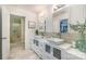 Modern bathroom featuring double vanities, stylish mirrors, and a glass-enclosed shower at 4517 Lake Shore N Rd, Denver, NC 28037