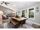 Elegant dining area featuring a rustic wooden table and views of the outdoors at 4517 Lake Shore N Rd, Denver, NC 28037