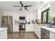 Modern kitchen with white cabinets, stainless steel appliances, and a sleek, functional design at 4517 Lake Shore N Rd, Denver, NC 28037