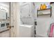Functional laundry room with a stackable washer and dryer, and storage shelves at 4517 Lake Shore N Rd, Denver, NC 28037