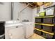 Laundry room with white washer and dryer, shelving, and storage containers for a functional space at 4517 Lake Shore N Rd, Denver, NC 28037