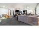 Spacious living area featuring a large sectional sofa, multiple seating options, and a large screen tv at 4517 Lake Shore N Rd, Denver, NC 28037