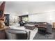Spacious living area featuring a large sectional sofa, multiple seating options, and a large screen tv at 4517 Lake Shore N Rd, Denver, NC 28037