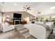 Cozy living room with a fireplace, mounted TV, and comfortable seating arrangement at 4517 Lake Shore N Rd, Denver, NC 28037