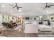 Open-concept living space with hardwood floors, modern furnishings, and abundant natural light at 4517 Lake Shore N Rd, Denver, NC 28037
