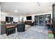 Spacious living room with large sectional sofa, TV, and french doors offering style and relaxation at 4517 Lake Shore N Rd, Denver, NC 28037