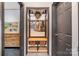 Organized mudroom with built-in bench, storage baskets, and hooks for coats and bags at 4517 Lake Shore N Rd, Denver, NC 28037