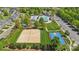 Aerial view showcasing community amenities, including a pool, volleyball court, and playground at 4648 Craigmoss Ln, Charlotte, NC 28278