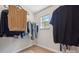 Walk-in closet with organized storage, clothing racks, and a window for natural light at 4648 Craigmoss Ln, Charlotte, NC 28278