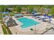 Aerial view of community pool, playground, and other recreational facilities within a green setting at 4648 Craigmoss Ln, Charlotte, NC 28278