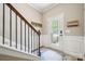 Inviting entryway with staircase and decorative accents creating a warm ambiance at 4648 Craigmoss Ln, Charlotte, NC 28278