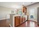 Open kitchen with stainless steel appliances, granite countertops, and wood cabinets at 4648 Craigmoss Ln, Charlotte, NC 28278