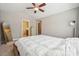 Inviting main bedroom featuring a platform bed, vaulted ceiling, and access to an en-suite bathroom at 4648 Craigmoss Ln, Charlotte, NC 28278