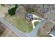 Aerial view of a well-maintained home with manicured lawn and a private, wooded lot at 503 Bridgestone Ct, Gastonia, NC 28056