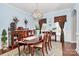 Dining room with beautiful chandelier, hardwood floors, and elegant decor at 503 Bridgestone Ct, Gastonia, NC 28056