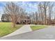 Charming two-story brick home featuring a well-manicured lawn and a long driveway leading to the entrance at 503 Bridgestone Ct, Gastonia, NC 28056