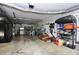 Functional garage space with exposed ductwork and ample storage for tools and equipment at 503 Bridgestone Ct, Gastonia, NC 28056