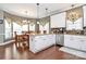 Spacious kitchen with white cabinets, granite countertops, stainless steel appliances, and adjacent dining area at 503 Bridgestone Ct, Gastonia, NC 28056
