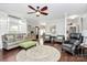 Spacious living room with hardwood floors, ceiling fan, and a comfortable seating area at 503 Bridgestone Ct, Gastonia, NC 28056